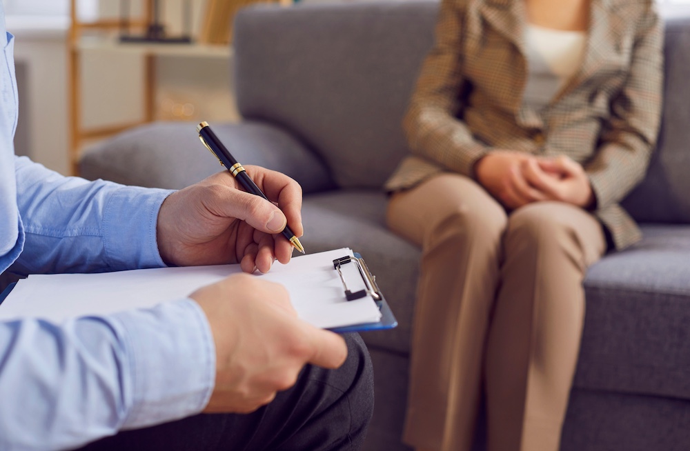 Psychiatrist, psychiatric doctor session for mental health professional help, writing form close up